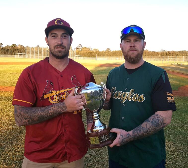 DECIDING FACTOR: Nathan Grogan from Wests Cardinals and Chad Blanch from Berkeley Eagles hold the trophy for the 2017 IBL First Grade Premiership. 
