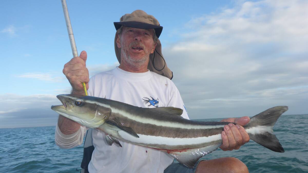 ON THE HOOK: Keith Willock is happy as with his cobia off the coast.