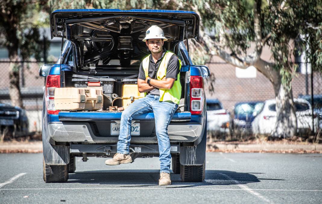 Plumber Alex Coleman, working at the Belconnen Markets with his tool-filled twin-cab ute. Picture by Karleen Minney 