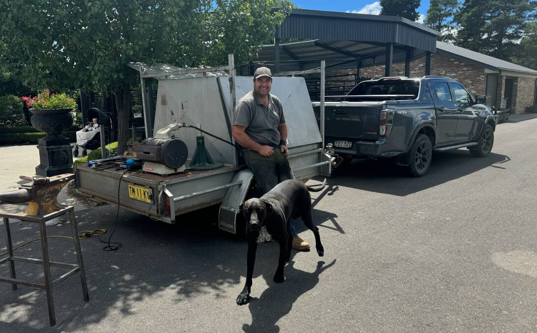 Farrier Tom Smith with his tool trailer and his dog, Brick. Picture supplied