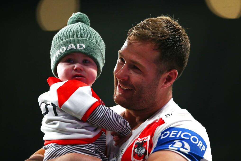 End of an era: Dragons utility forward Trent Merrin and son Mayne. Picture: Matt Blyth/Getty Images
