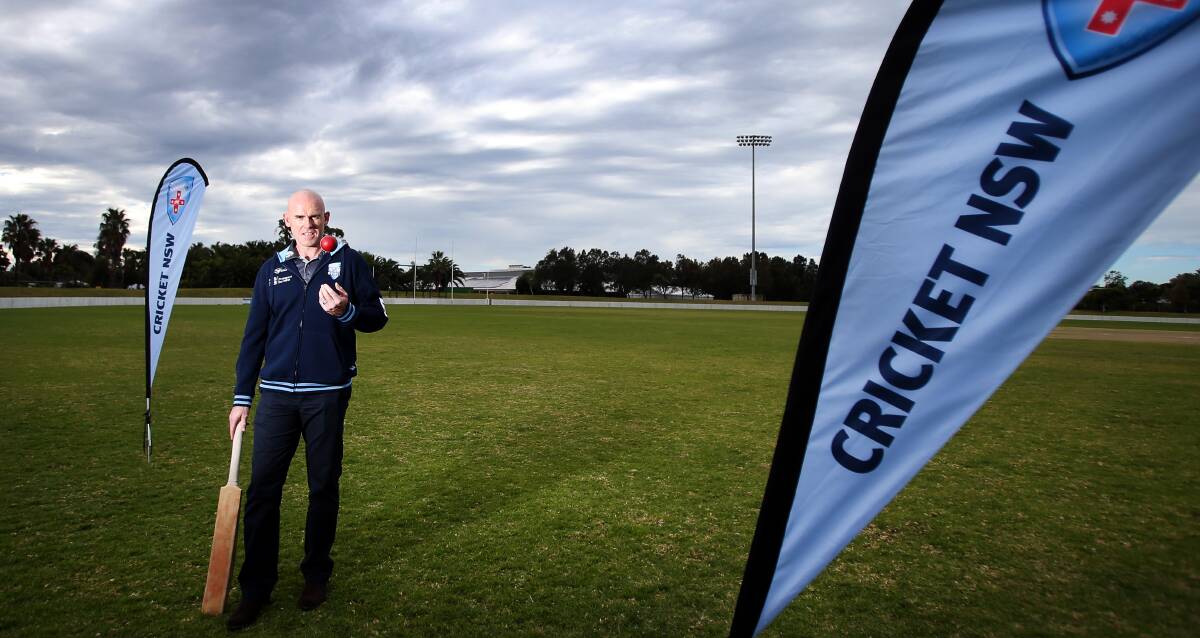 Leather and willow: Dapto junior and NSW coach Trent Johnston at North Dalton Park on Tuesday to announce next year's Sheffield Shield clash. Picture: Sylvia Liber
