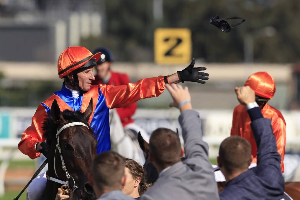 Date with destiny: Top jockey Glen Boss throws his goggles to the crowd after winning the George Ryder Stakes on Kerry Parker's Think It Over. Picture: Mark Evans/Getty Images
