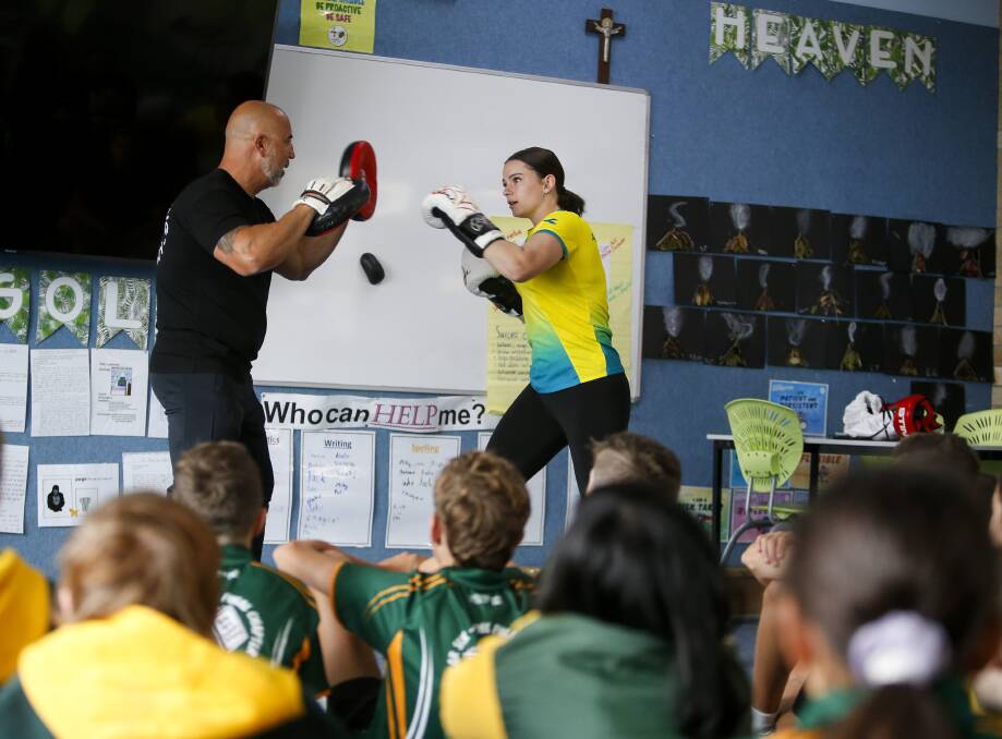 Learn the ropes: Nudge Mieli and Skye Nicolson demonstrate the sweet science of boxing at Stella Maris on Thursday. Picture: Anna Warr