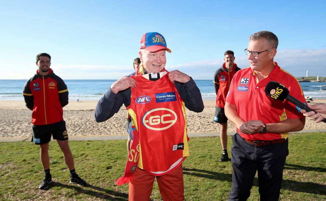 Life's a beach: Wollongong mayor Gordon Bradbery with Gold Coast chief executive Mark Evans. Picture: Sylvia Liber