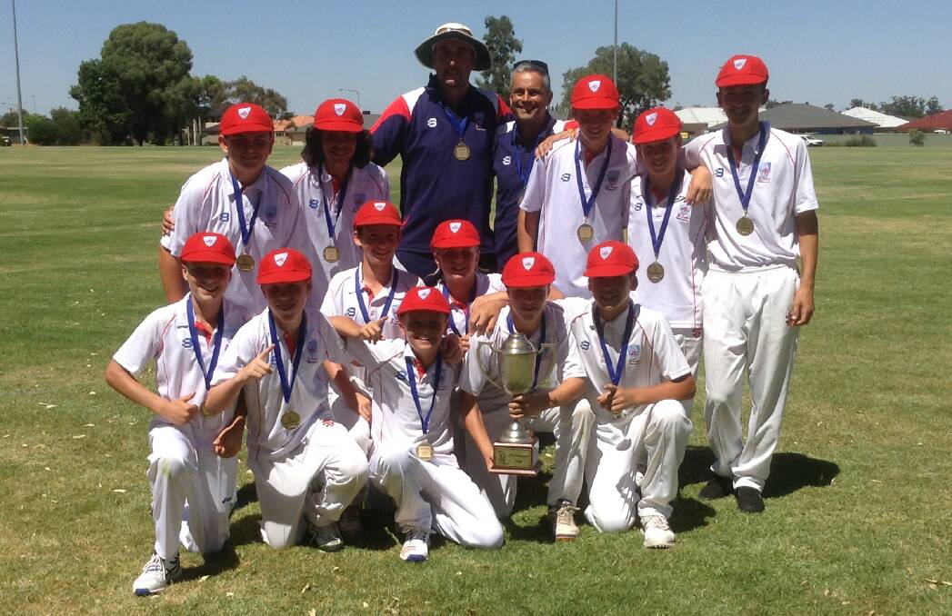 ON TOP: The Illawarra under 14 team celebrates winning the Kookaburra Cup at the end of the carnival in Griffith last week. 