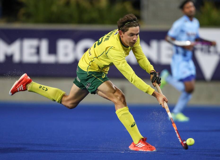 Golden glow: Wollongong's Flynn Ogilvie celebrated gold with the Kookaburras at the Commonwealth Games.