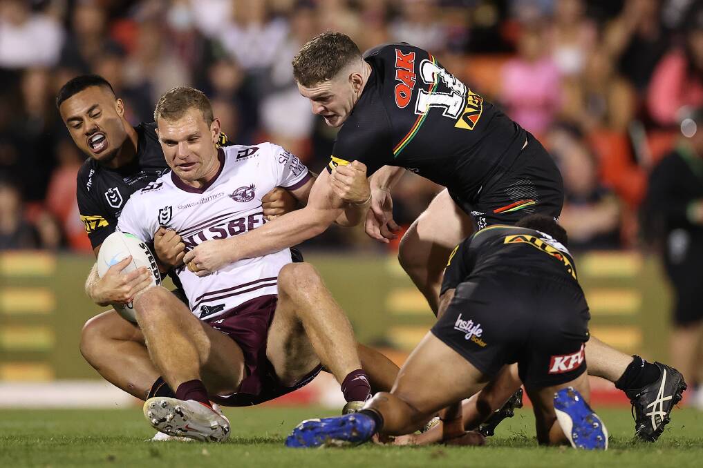 Crunch: Tom Trbojevic is stopped by the Panthers in round one. Picture: Cameron Spencer/Getty Images
