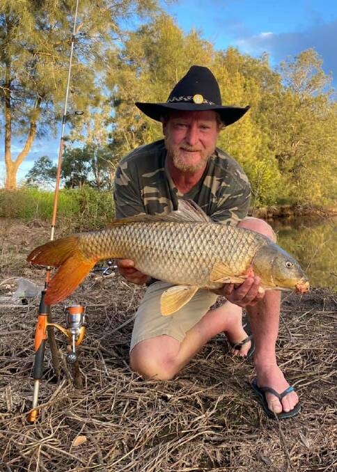 Lured in: Matty Hawkins with a lure caught carp of 675mm.