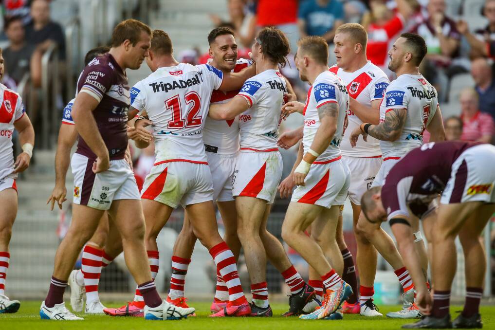 Times have changed: Dragons players celebrate in the win over Manly at WIN Stadium in round three. They meet the Sea Eagles again on Friday night, as they deal with mass suspensions. Picture: Adam McLean