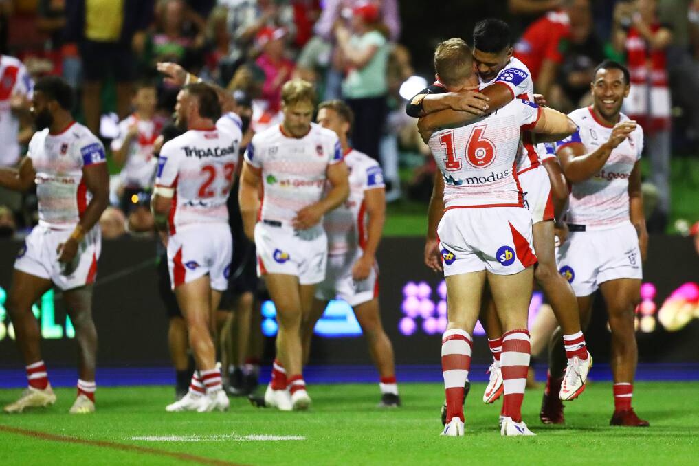 Winning feeling: Dragons' Talatau Amone and George Burgess celebrate Charity Shield success against South Sydney. Picture: Mark Metcalfe/Getty Images
