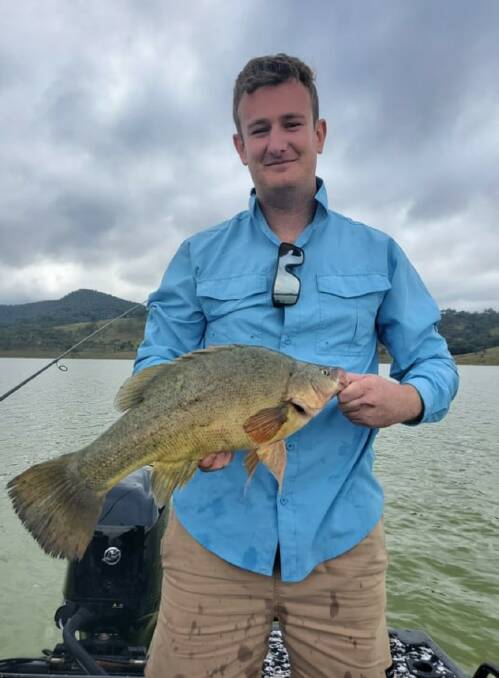 Search for gold: Connor Gilchrist with a good sized golden perch from a recent inland escape.