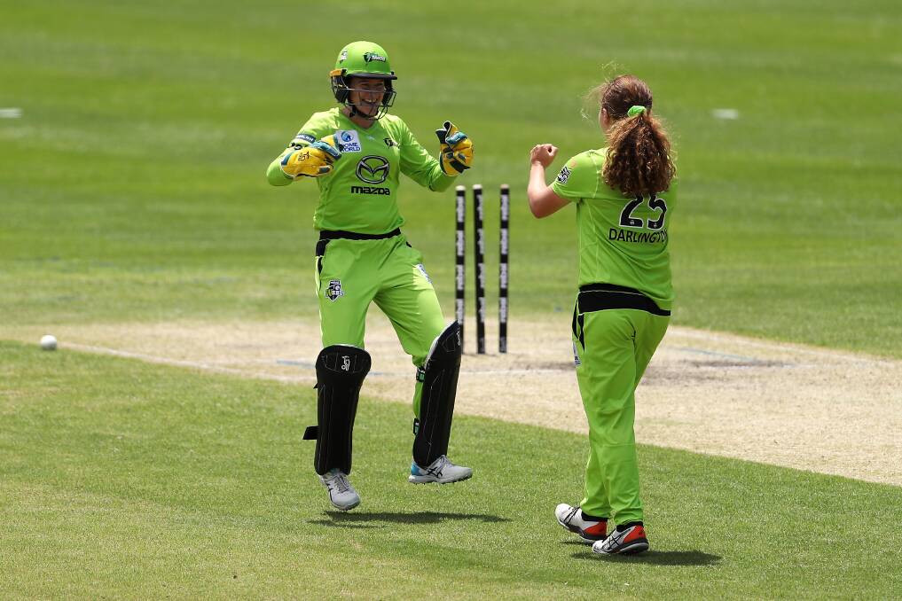 Wicket fall: Tahlia Wilson and Hannah Darlington of the Thunder celebrate during the Women's Big Bash League competition. Picture: Mark Kolbe/Getty Images