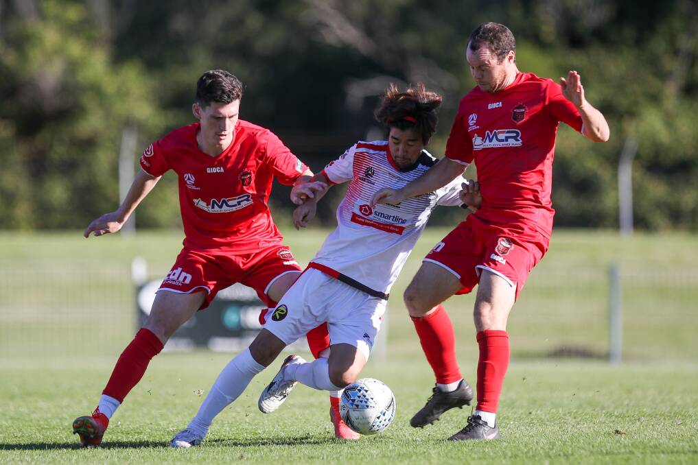 Surrounded: Rockdale's Tomoki Wada takes on Wolves duo Dax Kelly (left) and Brendan Griffin. Picture: Adam McLean