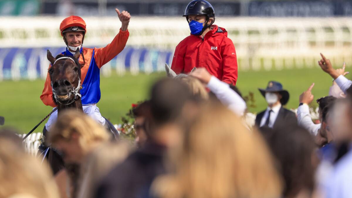 Thumbs up: Nash Rawiller after winning the Rosehill Gold Cup. Picture: Mark Evans/Getty Images

