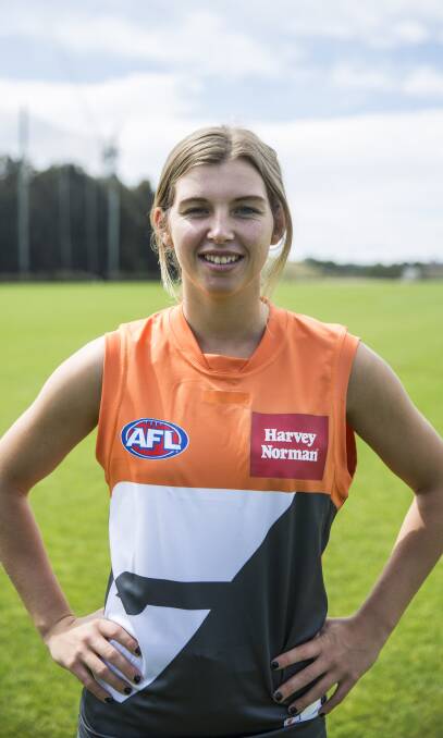 GIANT MOVE: Greater Western Sydney recruit Maddy Collier, a Nowra product and former Wollongong Saints player, shows off her AFL colours.