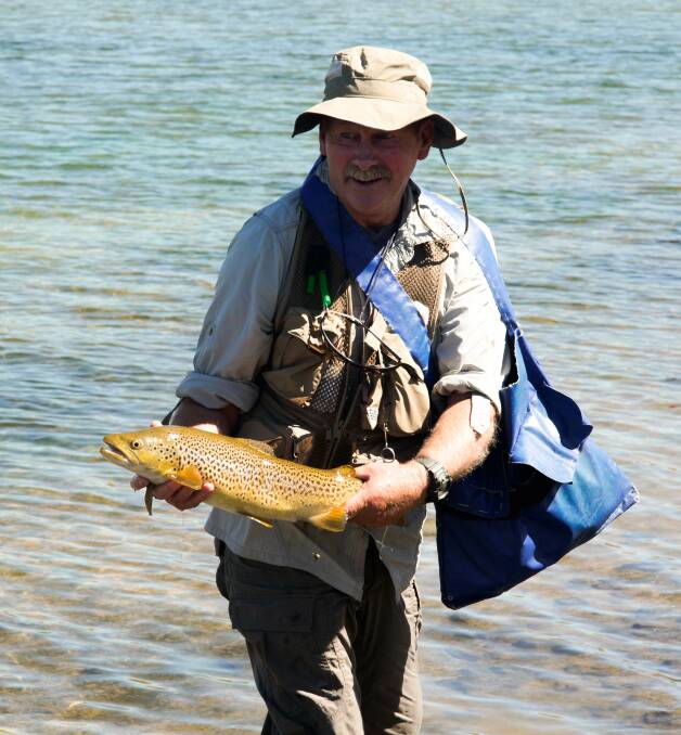 Reel it in: Shellharbour's Allan Griffiths with a solid brown trout during a New Zealand fishing expedition. 