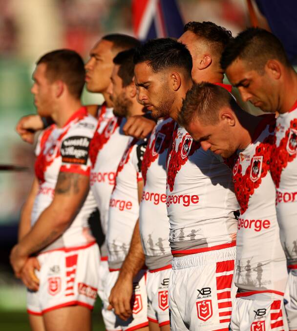 Lest we forget: ANZAC Day pre-game ceremony. Picture: Cameron Spencer/Getty