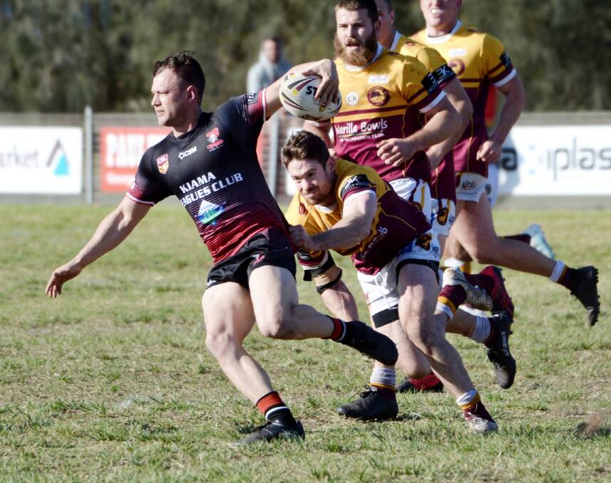 Come here: Jay Delaney tries to evade the Shellharbour defence in Sunday's preliminary final win at Cec Glenholmes Oval. Picture: Greg Rigby Sports Photos