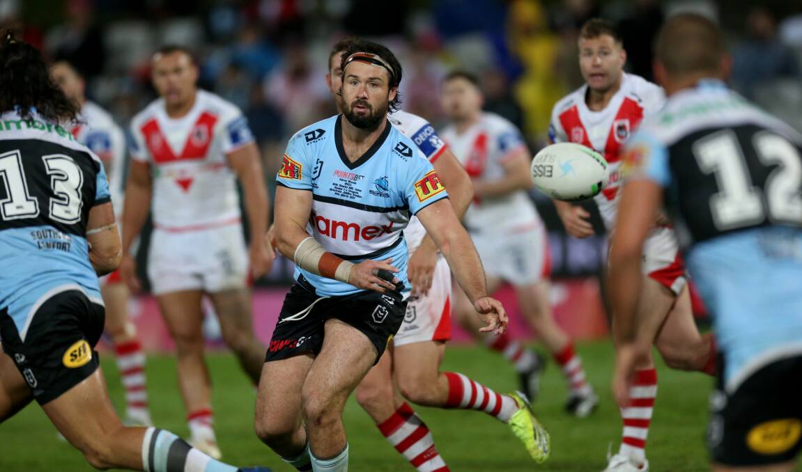 New colours: Aaron Woods playing for the Sharks against the Dragons this year. Picture: Geoff Jones
