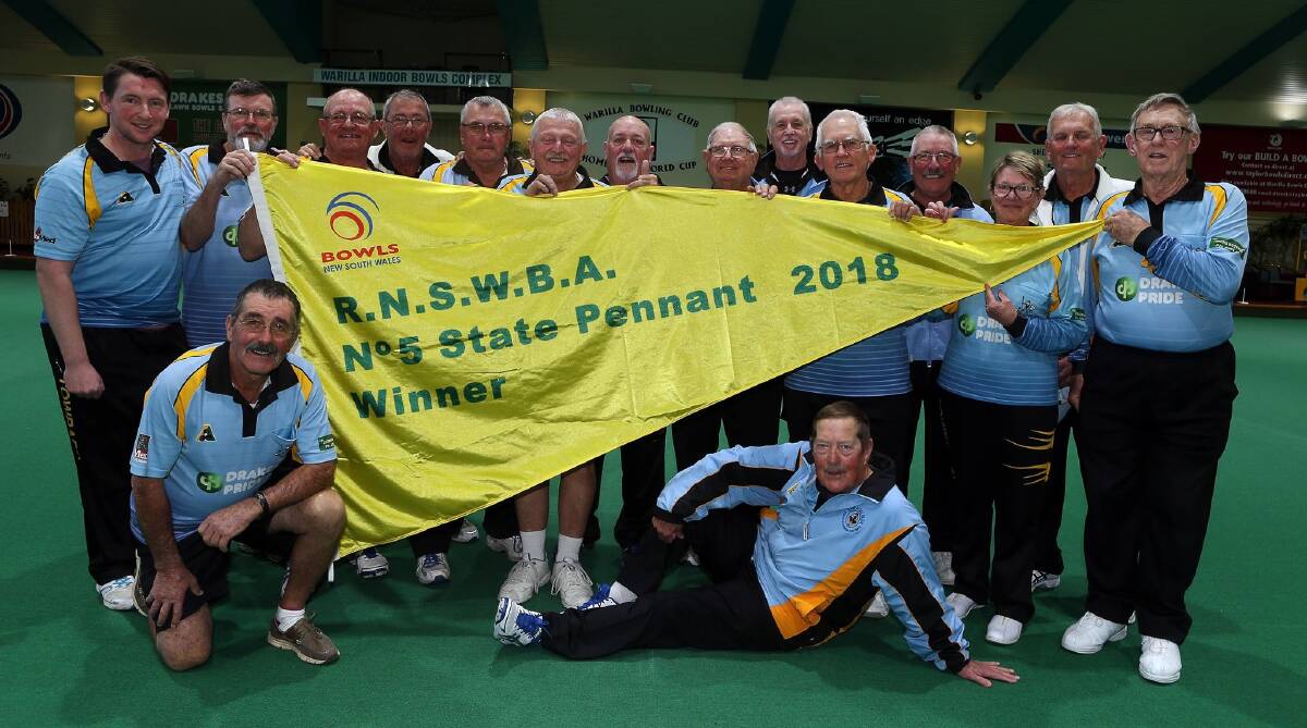 Champs: The Towradgi Grade 5 squad celebrate their state pennant victory at Warilla Bowls Club.