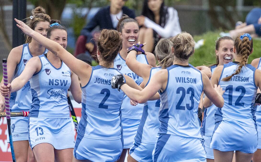 Celebrate: NSW players during the AHL final on the Gold Coast on Sunday. 