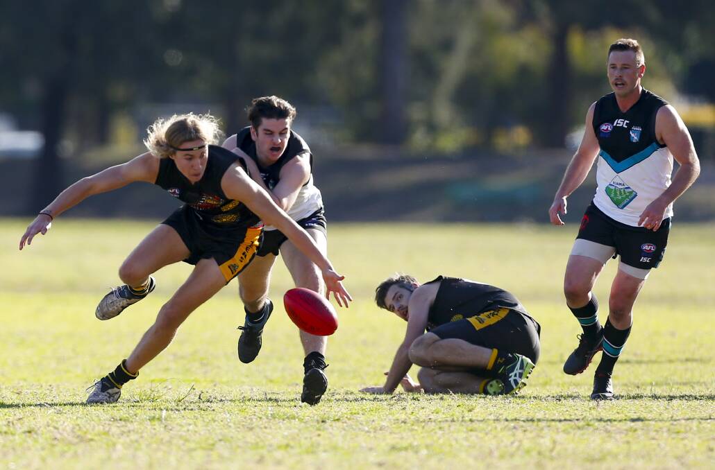 Pressure: Owen Kocyan is in front for Northern Districts against Kiama last year. Picture: Anna Warr