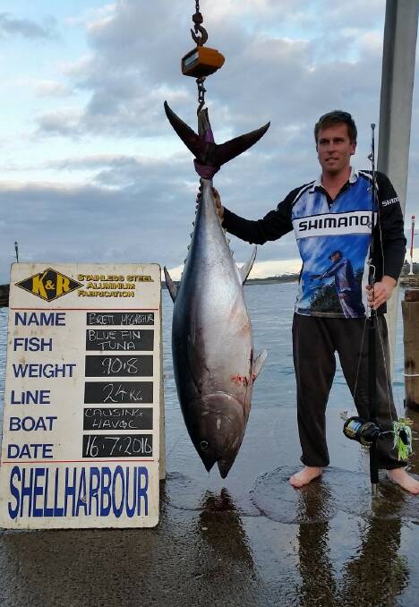 What a catch: Brett McGregor stands with with a 90-kilogram southern bluefin at Shellharbour last week. 
