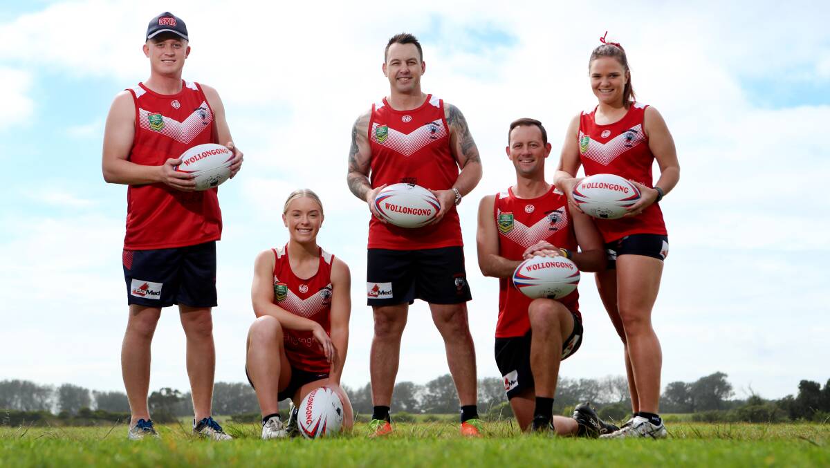 New colours: Wollongong's Tim Robinson (second from right) - with partner Lauren Rynehart (right) - has been selected in the Australian over 35s team. Picture: Sylvia Liber