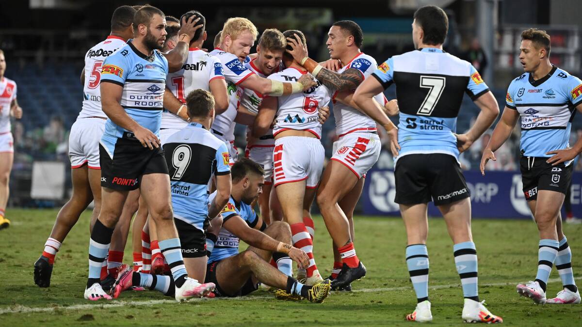 Success: The Dragons celebrate a try against the Sharks in a St George Illawarra home game at Campbelltown earlier this season. Picture: Grant Trouville