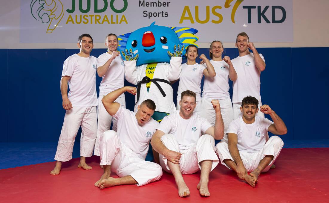 Team dream: Tinka Easton (back row, middle, next to mascot) with some of the Australian judo team members. Picture: Daniel Pockett/Getty Images
