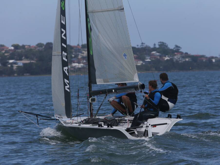 SAIL AWAY: Belmont's Matthew Rhys-Jones and crew compete in the 16-foot skiff national titles on Lake Illawarra this week. 
