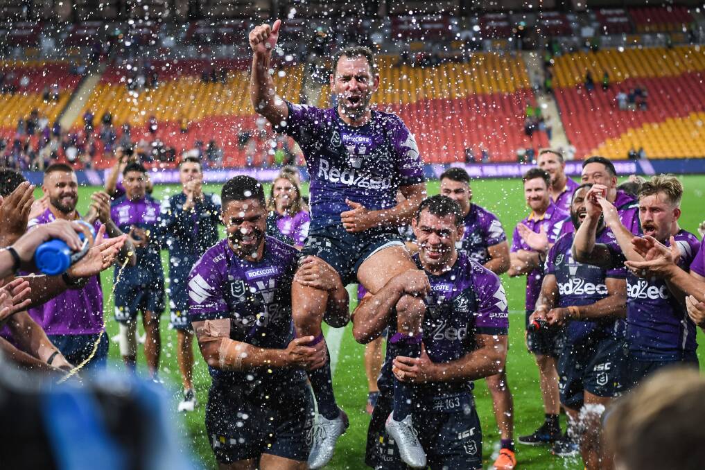 Final call: Cameron Smith chaired off after the Storm beat Canberra to make the NRL decider. Picture: Nathan Hopkins/NRL Imagery
