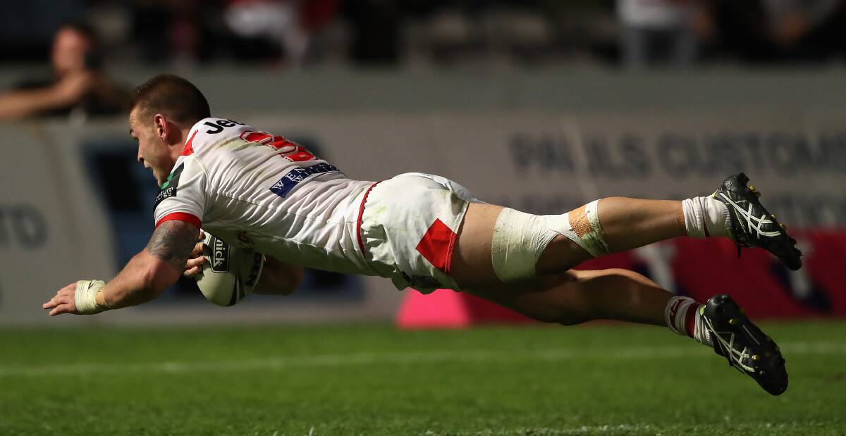 Golden glow: Euan Aitken scores to seal victory for the Dragons against Canberra on Thursday night, but tries have been hard to come by this season. Picture: Getty Images