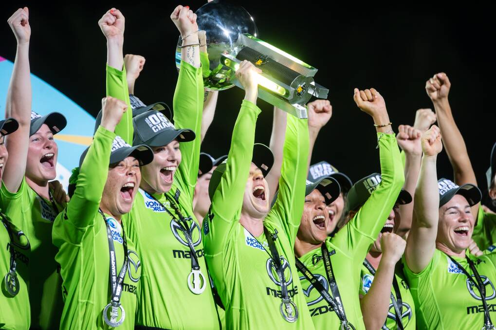 Easy being green: The Sydney Thunder lift the Women's Big Bash trophy. Picture: Sydney Thunder