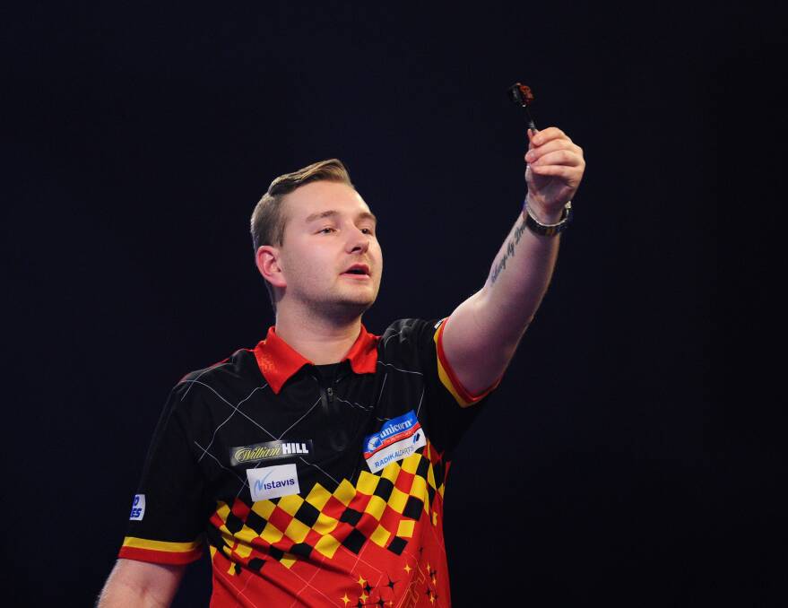 Ready: Dimitri Van den Bergh is part of the world darts masters in Wollongong. Picture: Alex Burstow/Getty Images