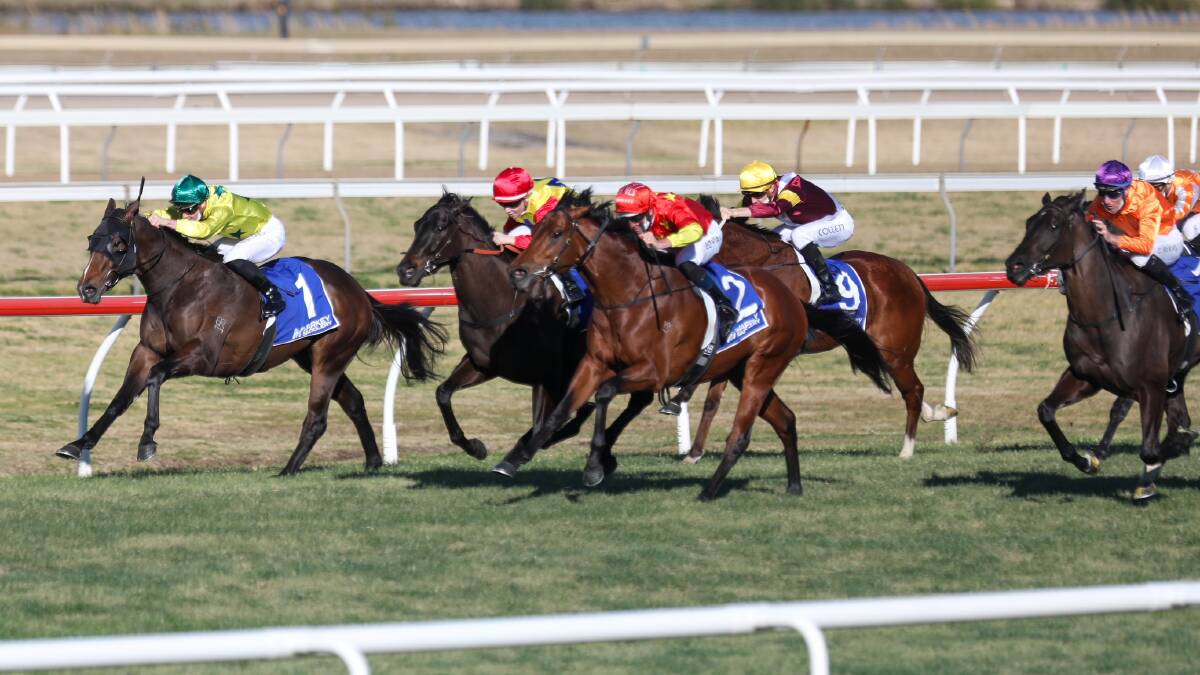 Late charge: Hugh Bowman (No.2) wins on Construct ahead of Ellen Hennessy on Wolves (middle) on Thursday. Picture: Adam McLean