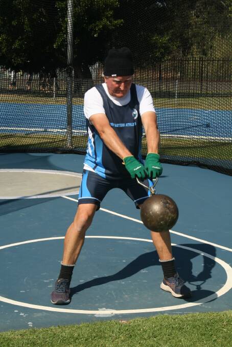 Winding up: Dave Ross in the 100-pound throw event. Picture: Jill Taylor/NSW Masters Athletics Assn