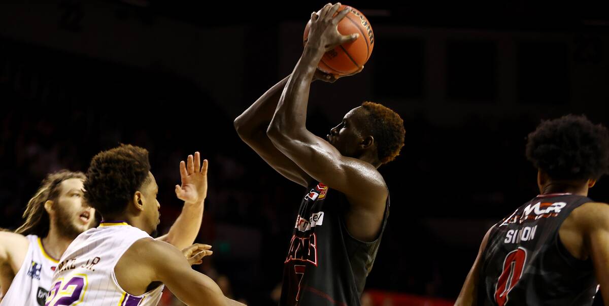 Rise: Deng Deng shoots for the Hawks in Saturday night's loss to Sydney in Wollongong. Picture: Mark Nolan/Getty Images
