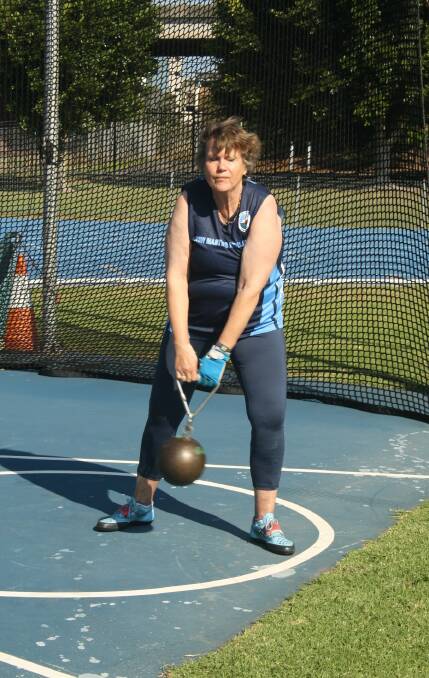 Back in action: Adriana van Bockel competes in the 56-pound throw at Kerryn McCann Athletics Centre. Picture: Jill Taylor/NSW Masters Athletics Assn