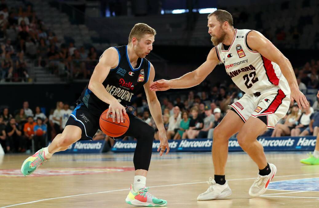Take me on: Tim Coenraad (right) played a key role in the Illawarra Hawks win over Melbourne United on Sunday. Picture: Kelly Defina/Getty Images
