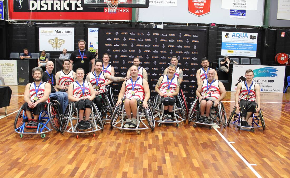 Threepeat: The Wollongong Roller Hawks celebrate winning last year's National Wheelchair Basketball League.