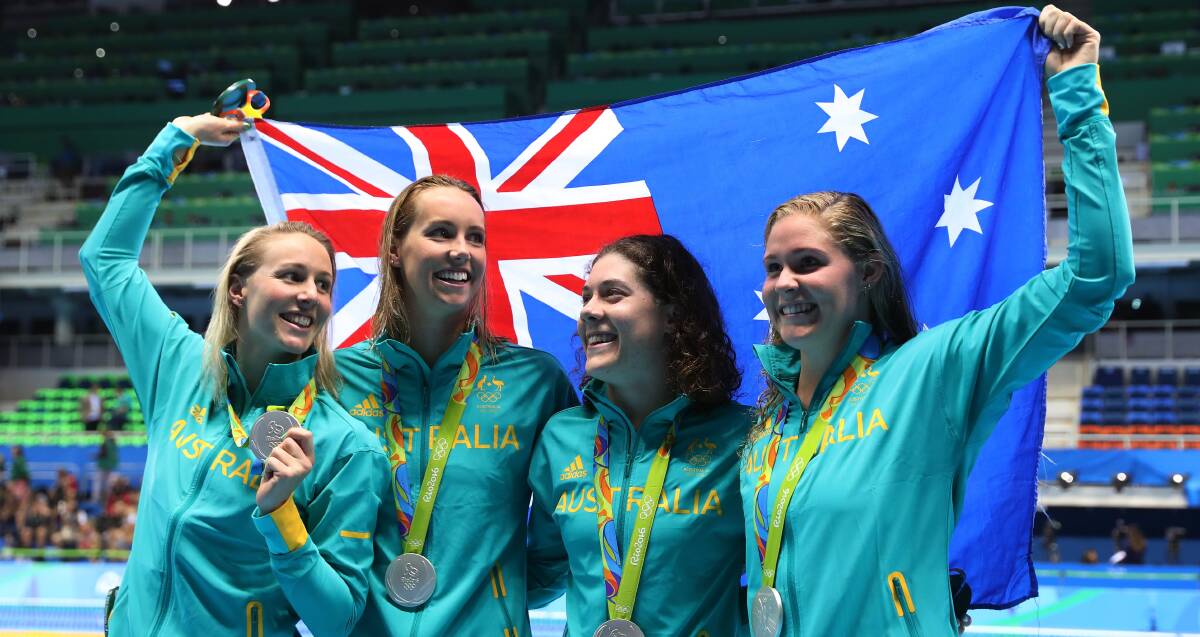 Success: Emma McKeon (second from left) celebrates during the Rio Olympics swimming campaign. Picture: Getty Images