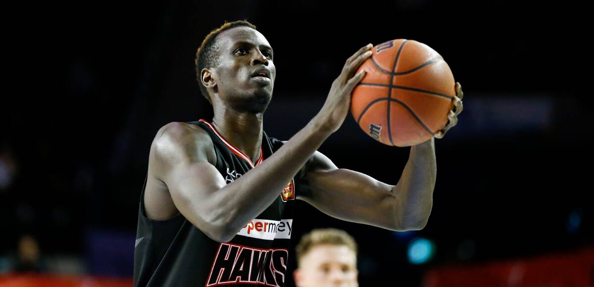 Aiming up: Deng Deng will return for the Hawks next season. Picture: Anna Warr