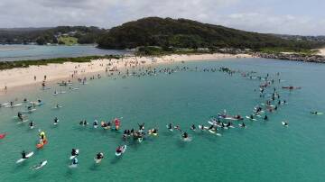 Hundreds paddle out to protest South Coast marine park rezoning