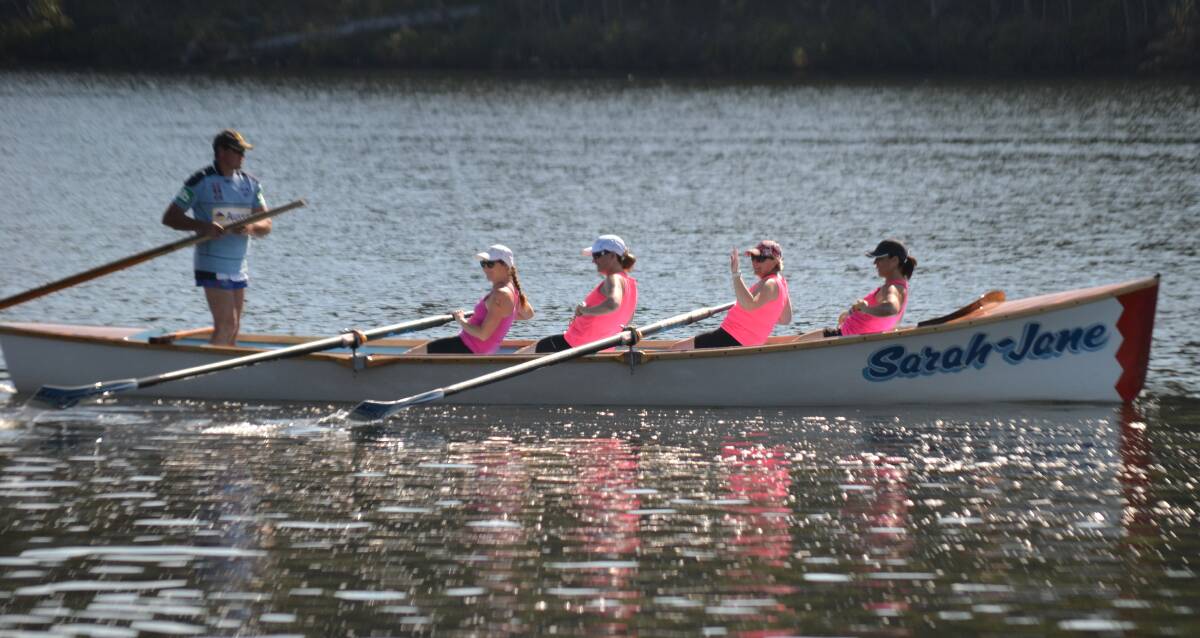 PADDLE POWER: Sweep Darren Reidy and Broulee Bats rowers Kerryl Davie, Michelle Zutt, Melisa Clarke and Kimberli Eke at the girls' day out in Nelligen. 