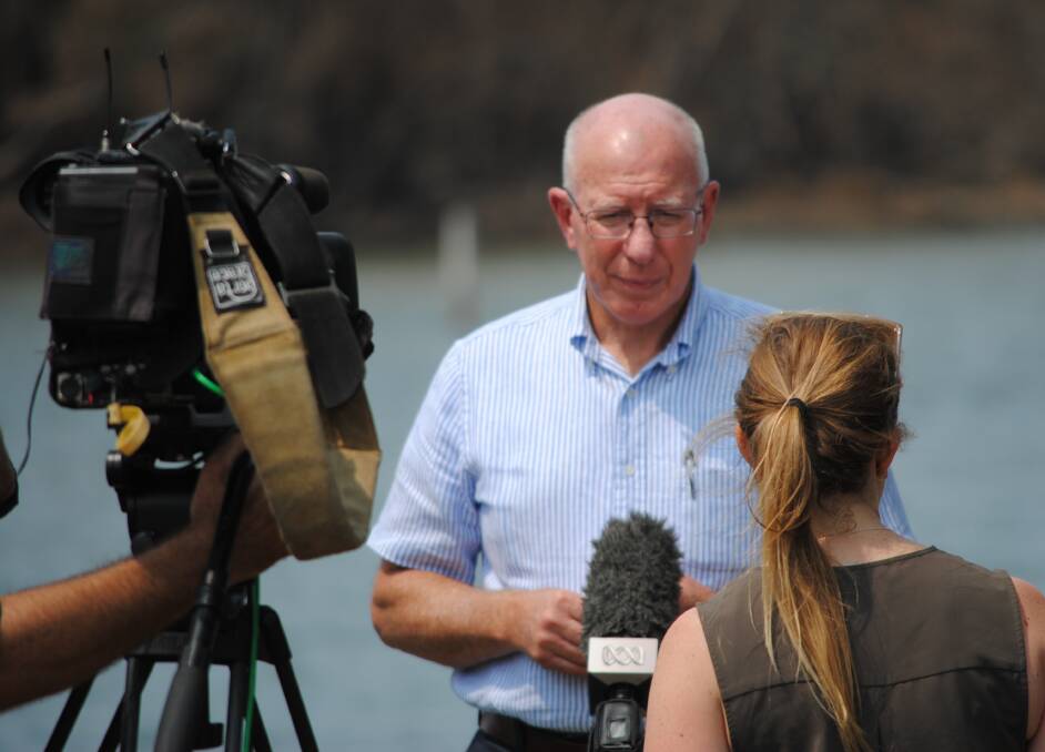Governor General David Hurley speaks to emergency broadcaster ABC at Lake Conjola.