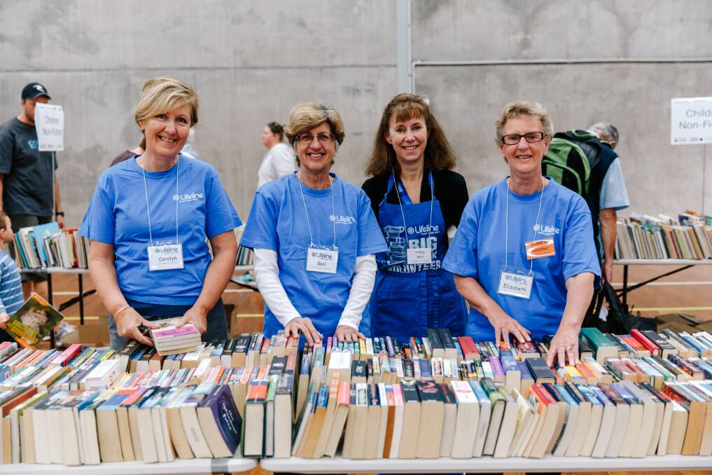 VOLUNTEERS: Lifeline South Coast volunteers have done an amazing job in sorting, categorising and pricing all the books for the Big Book Fair. 
