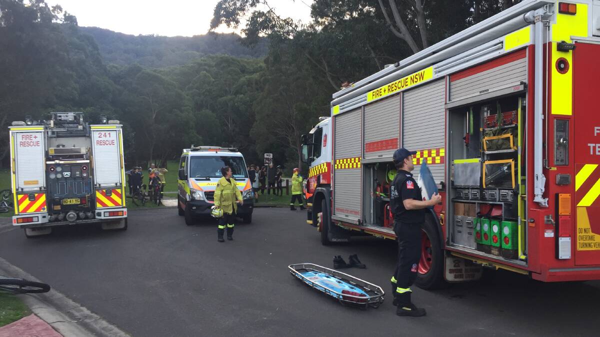 Crews arrive at Doonan Place Reserve, near the bottom of the track, Monday evening. Picture: Robert Peet 