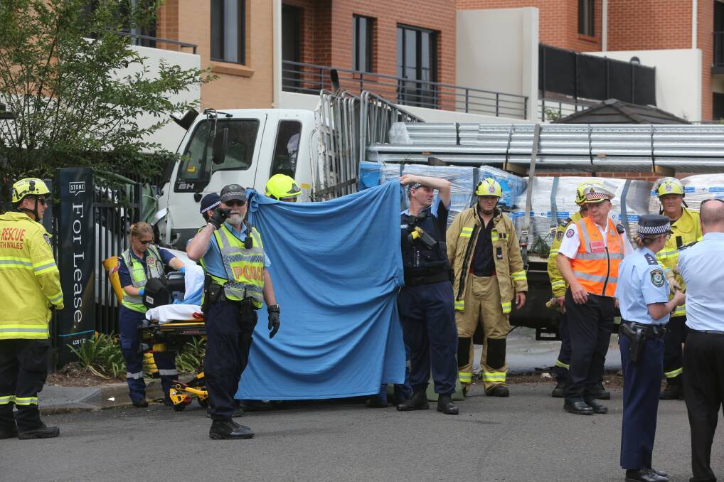 Emergency services shield an injured party in the aftermath of the November 5, 2018 crash. 
